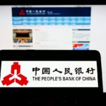 Stuttgart, Germany 09 19 2022: Person Holding Cellphone With Logo Of Financial Institution People’s Bank Of China On Screen In Front Of Webpage. Focus On Phone Display.